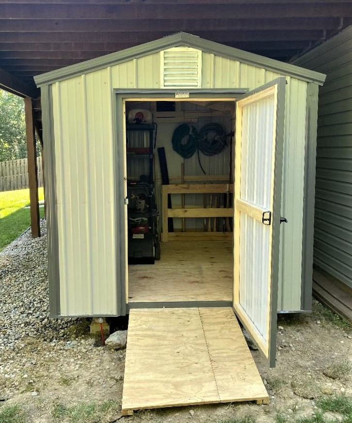 open bargain barn with a ramp, tools organized inside