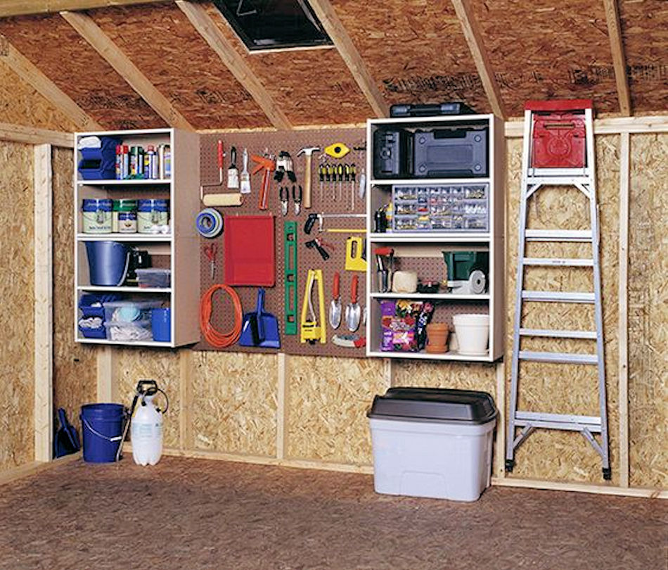 inside garage with pegboards and shelves for storage