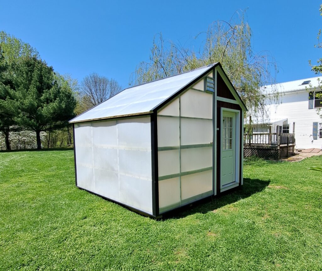 12x12 greenhouse with dark brown siding and white door, best sheds for gardening