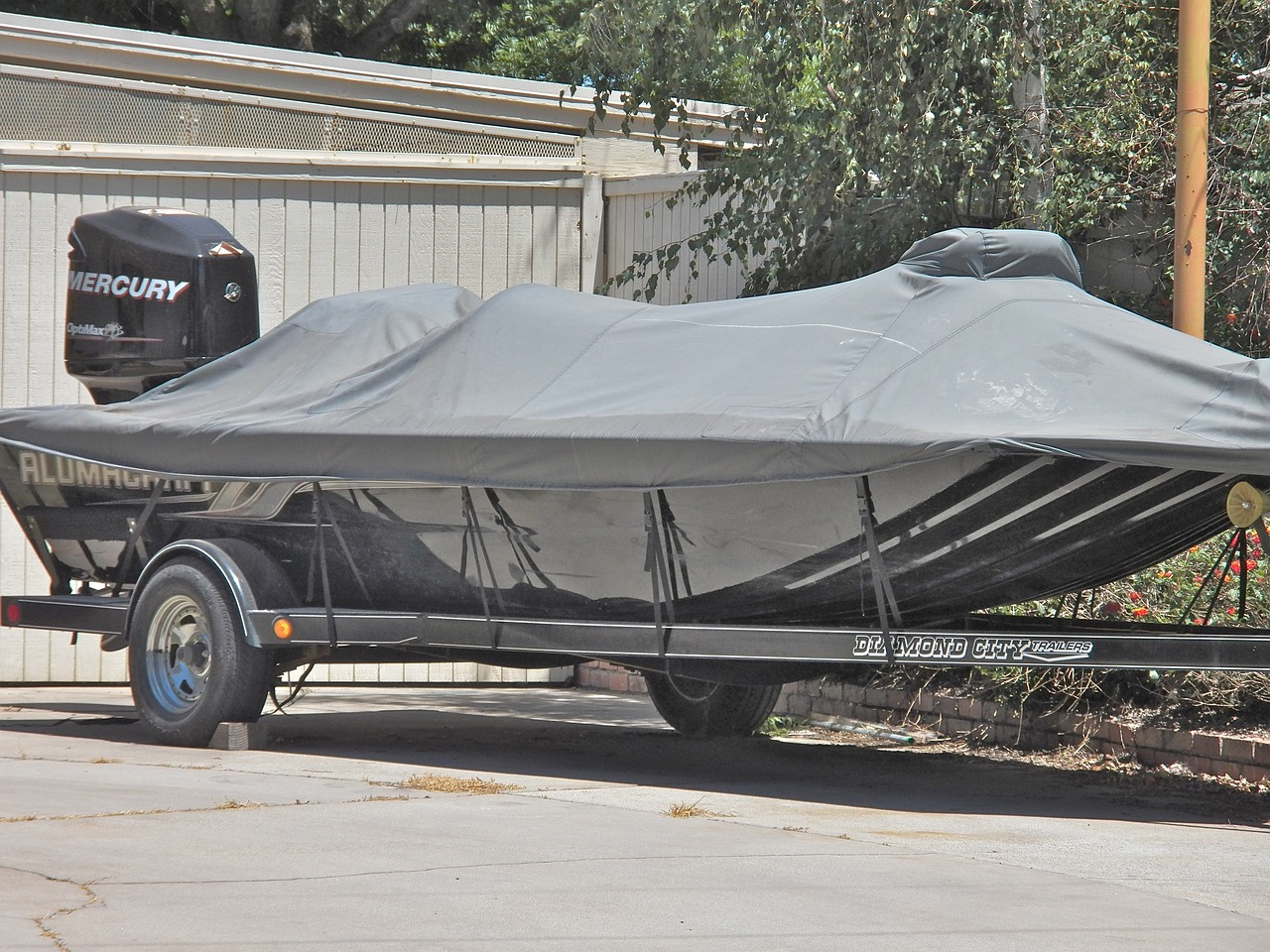 boat on a trailer with a boat cover