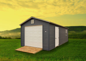 vinyl a-frame garage with gray siding, white door, and ramp