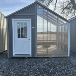 greenhouse with gray siding