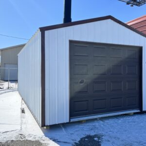 one car garage with white siding and black garage door