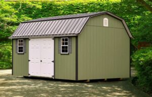 lofted garden shed with green siding