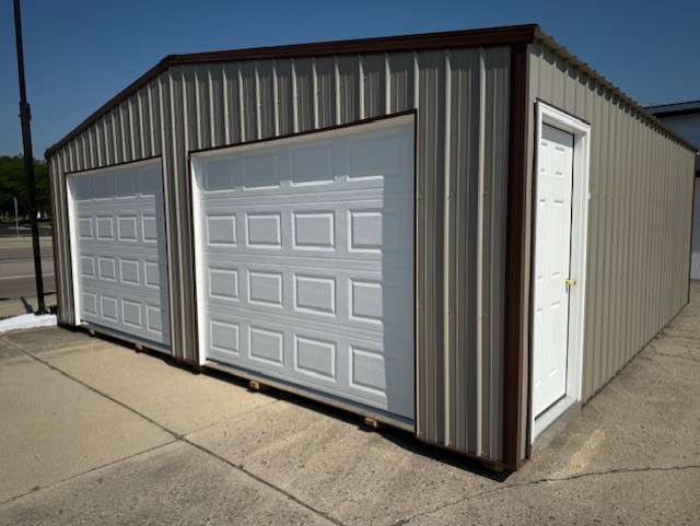 two car garage with tan siding