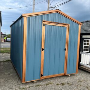 bargain barn with blue siding and copper trim