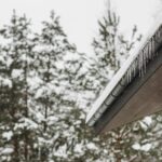 roof with snow and icicles hanging off, preparing your sheds for winter storms