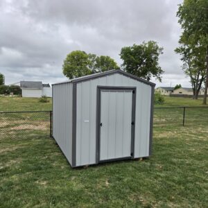 bargain barn with white siding and gray trim
