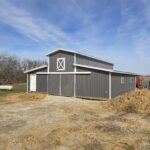 monitor horse barn with gray siding