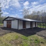 heritage horse barn with roof overhang