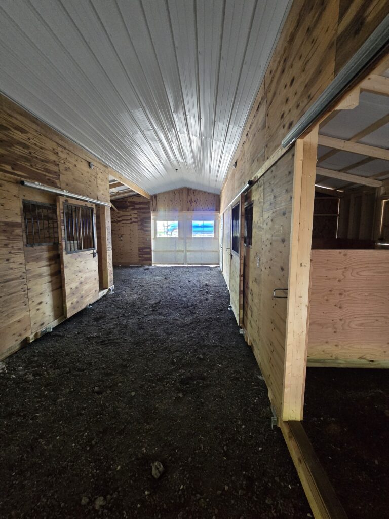 aisle and stalls in heritage horse barn