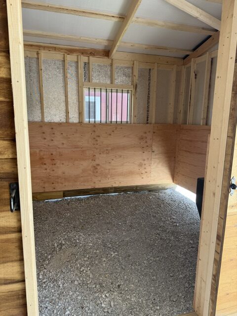 inside a horse stall in a heritage barn