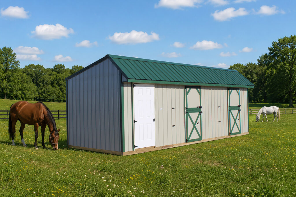 deluxe horse barn with cream siding, green trim, and green roof