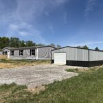 2-car garage with grey and black siding