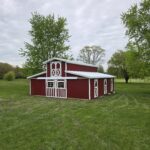 monitor horse barn with red siding and white trim
