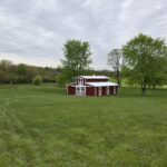 monitor horse barn in a field