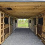 center aisle in monitor horse barn