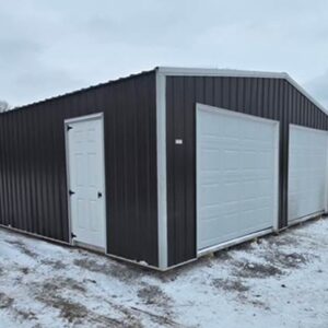 Two-car garage with 2 white garage doors, a single-entry side door, white trim, and dark metal siding.