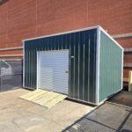 utility shed with green metal siding