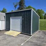 utility shed with green siding