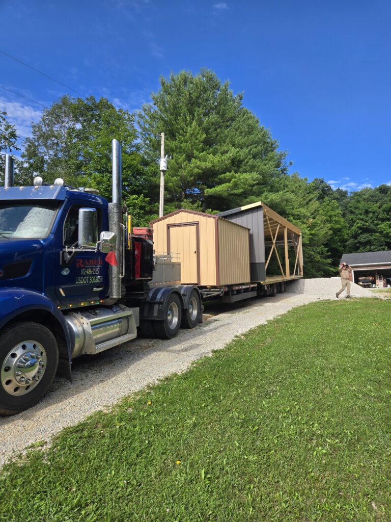 delivery truck with bargain barn and half of a two car garage
