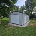 one car garage with gray metal siding